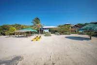 Coral Beach Retreat – Private Beachfront Escape