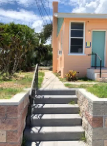 Tropical Oasis Steps to the Beach - Charming Hideaway with Fenced Yard