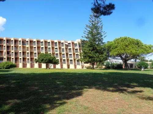 Waterfront apartment with pool and private beach access.