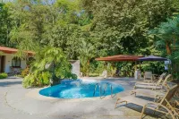 Private suite 103 with beautiful gardens, shared pool and BBQ area!