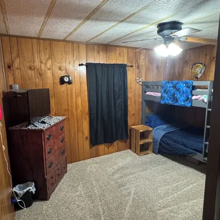 Quiet cabin in the woods w/ access to pools, river, & lakes in gated community!!