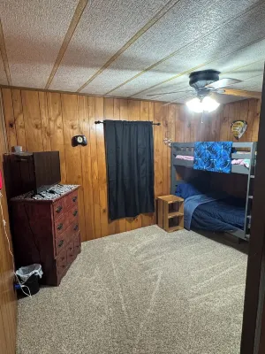 Quiet cabin in the woods w/ access to pools, river, & lakes in gated community!!