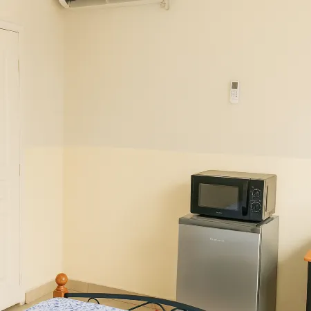 Cozy Guest Room in Kinshasa with Balcony and Partial Air-Conditioning