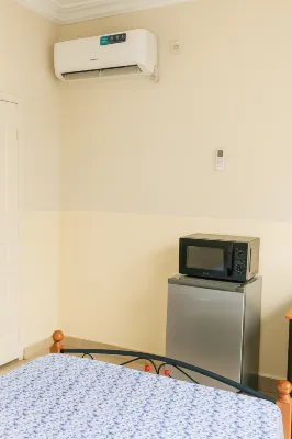 Cozy Guest Room in Kinshasa with Balcony and Partial Air-Conditioning Hotels in 