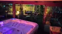 Private, quiet accommodation in architect-designed house with pool, spa, private garden
