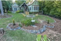 Captain’s Cove Lake Cottage with Dock, Pool, & Game Room Hotels in 