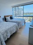 Beach and city views in condo with backyard access to beach and walkable town.