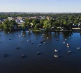 Lake home, across the street from a golf course & minutes to shopping and more!