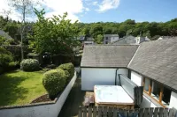 Detached lakeland cottage, with private hot tub and leisure facilities, pool