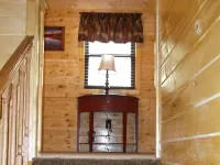 3BR 2 Bath house with full kitchen, living room, and hot tub.
