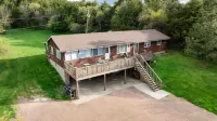Steps from the water, firepit, large yard, family friendly