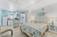 Poolside Studio Retreat and Private Beach Access - Charming Oasis