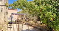 Cottage with private garden in wooded property with swimming pool