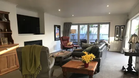 A modern house close to town and the beach and backs on to a tree lined park