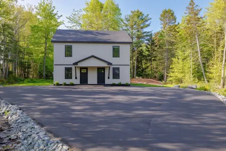 Charming 2-bedroom apartment nestled in a quiet neighborhood with nearby stream.