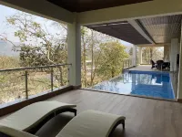 A 4 BHK VILLA WITH A PRIVATE INFINITY POOL SURROUDED BY SERENE HILLS