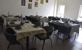 a well - organized dining room with tables and chairs arranged for a group of people to enjoy a meal together at The Heritage