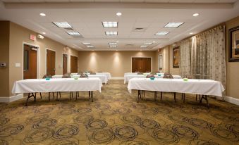 a large conference room with multiple tables and chairs arranged for a meeting or event at Holiday Inn Express Pembroke