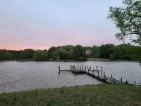 Private Riverfront Home with dock Hotels in Cople