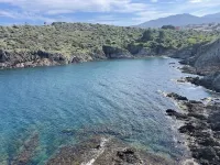Just a stone's throw from the port and 300 m from a cove.