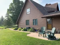 Our Thunder Moon Farm Stay- sleeps 7, framed by wildflowers. 4 miles to GB.