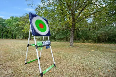 Secluded 4 bedroom farmhouse nestled on 8 acres with large lawn and oak trees.