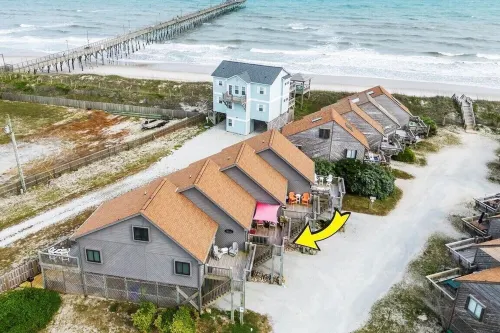 Beachfront 2-bedroom townhome, private beach access, outdoor space & amenities.