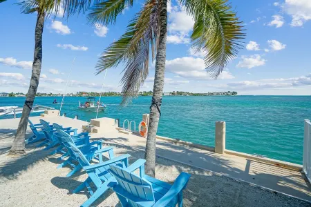 Oceanfront PARADISE w Heated pool, 55’ dock, ocean view & bathroom in every room