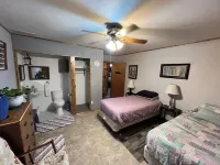 Log Cabin house on 10.5 acers of wooded land. Accommodates 20 plus guest.