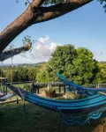 Tiny house on an acre with ocean view and private infinity pool.
