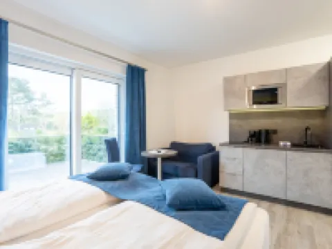 ฟามิเลียนแอนด์อพาร์ทโฮเทล ซตรานด์โฮฟ โรงแรมในTossens