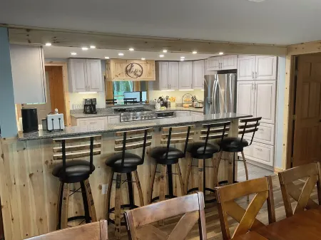 Welcoming lake house with five bedrooms and a huge deck on Tee lake in Lewiston.