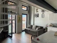 Open-plan loft overlooking Lake Como with private parking space Hotels in Malgrate