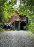 Spacious suite surrounded by nature with living room, fireplace, porch, fire pit