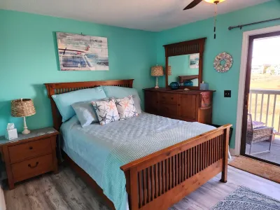 Cozy condo located one block from Carolina Beach and Freeman Park. Hotels near Veteran's Park Shelter