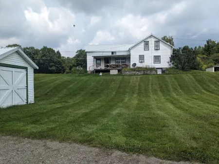 Private tent camping along the Salmon River on 165-acre Farm.