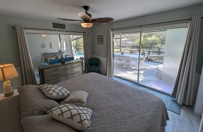 Waterfront Paradise w dock, large patio, lanai, pool, hot tub! Bring your boat!