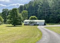 Comfy Getaway w/ stream and bridge out back