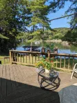 Direct lakefront cottage with wood burning fireplace in great room. Pet friendly