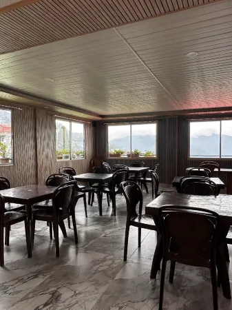 Queen's Inn Homestay Отели рядом с достопримечательностью «Himalayan Mountaineering Institute»