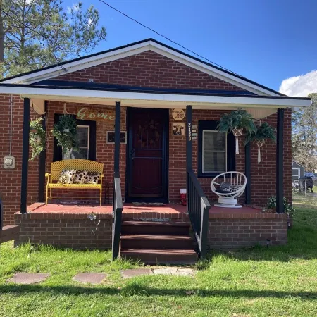 Updated bungalow with screened in porch in rear.