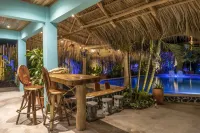 Private beach house paradise w/ private pool bar and game area.