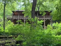 Spacious suite surrounded by nature with living room, fireplace, porch, fire pit