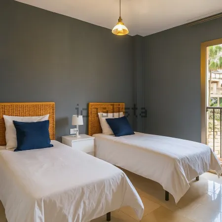 Chic 3-bedroom apartment with WiFi, AC & stunning sea + golf views near Marbella