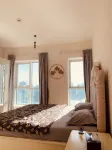 Cozy 2-bedroom apartment in superb Sharjah corniche with WiFi, fitness room pool โรงแรมใน
