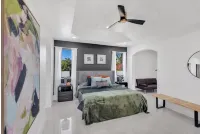 This Miami Vice Villa home is a stunning Saltwater Heated pool/Jacuzzi spa Oasis