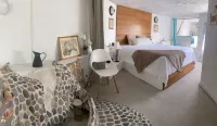 Unique mosaic eco-friendly open concept space sleeps 4 -WiFi, seawater pool, BBQ Hotels in 