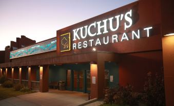 "a large restaurant with a sign that reads "" kuchus restaurant "" prominently displayed on the building" at Ute Mountain Casino Hotel