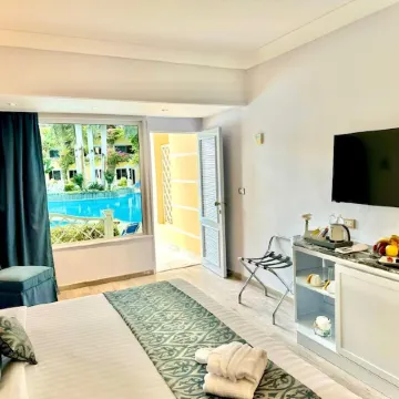 Paradise Inn Beach Resort Отели рядом с достопримечательностью «Пляж Мамура»