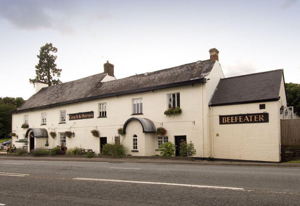 "a large white building with a sign that says "" befata "" is located on the side of a road" at Premier Inn Cardiff East